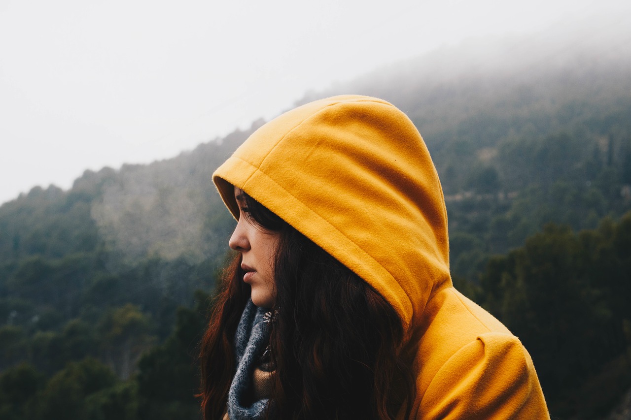 How to file taxes if divorced during year. Young woman with hoodie. #taxtips #divorce