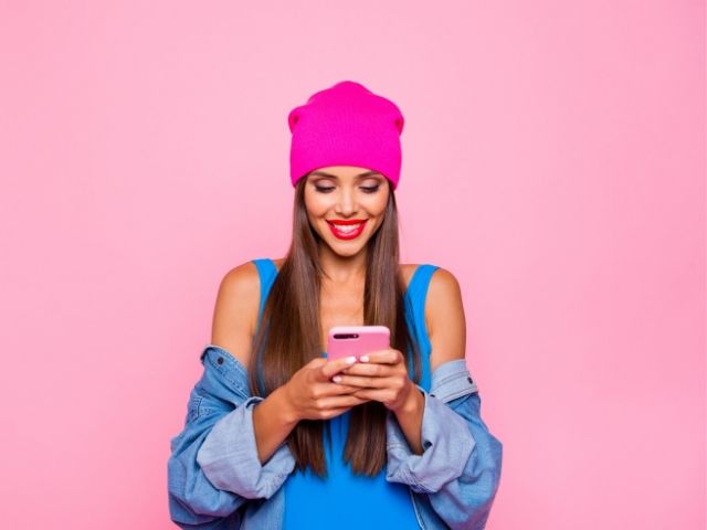 Social Media influencer making money from home with Female Texting on Phone