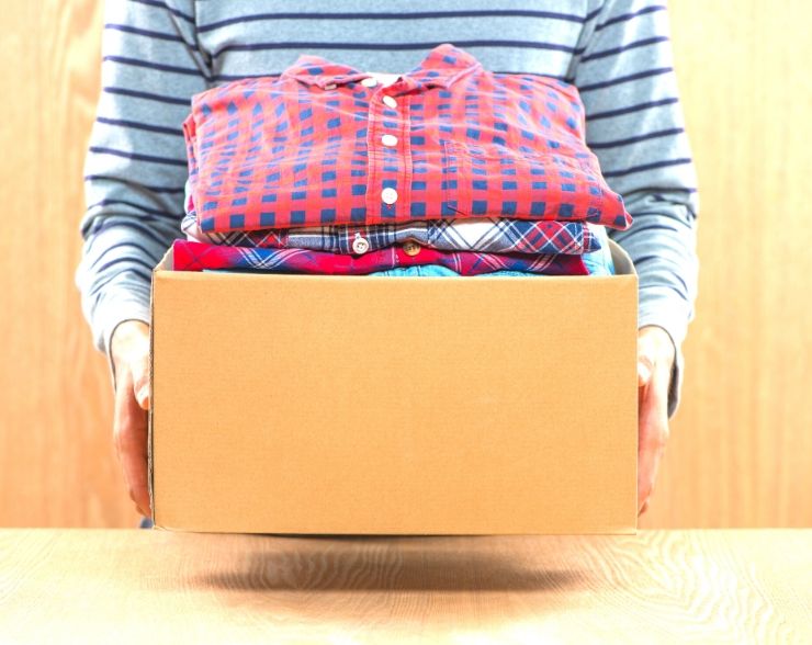 Box of clothes to sell to help save money fast