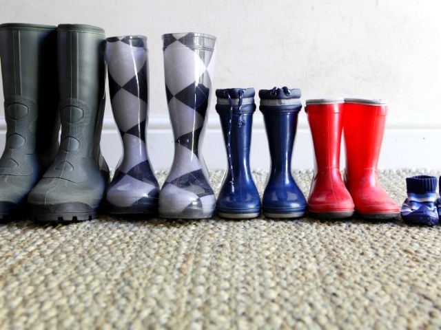 Tax Season Preparing know your filing status. A top tax tip with colorful rain boots lined up together.