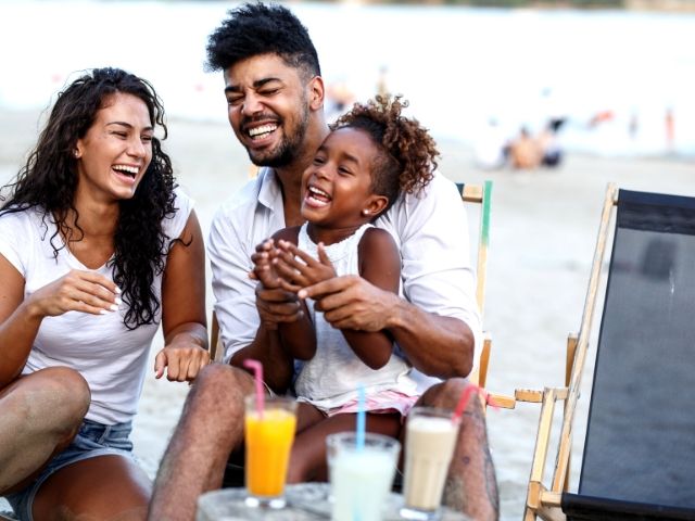 Tax Season Preparing know if you qualify for the Earned Income Credit. A top tax tip with happy family on the beach.