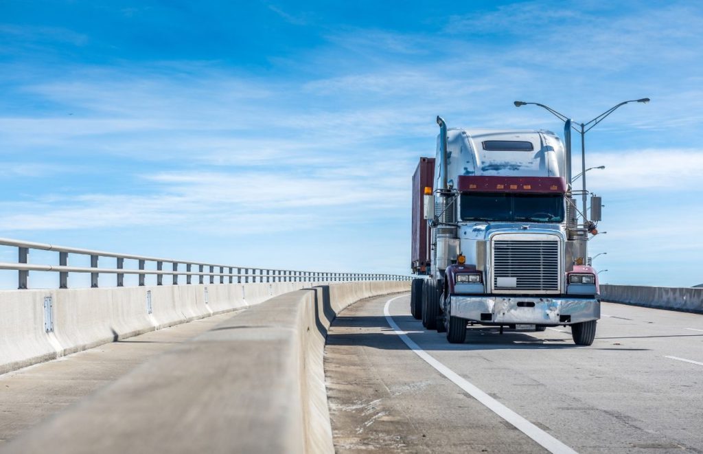 IRS Form 2290 trucker driving on scenic highway