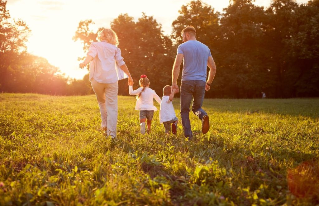 Child Tax Credit with young family running in the field