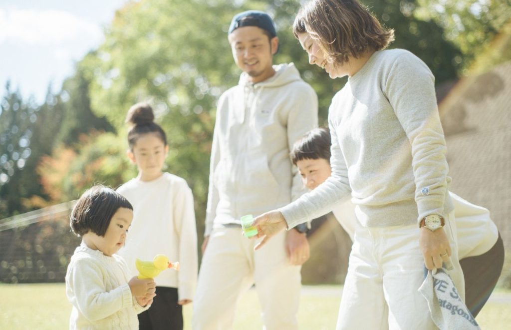 Child Tax Credit young Asian family blowing bubbles