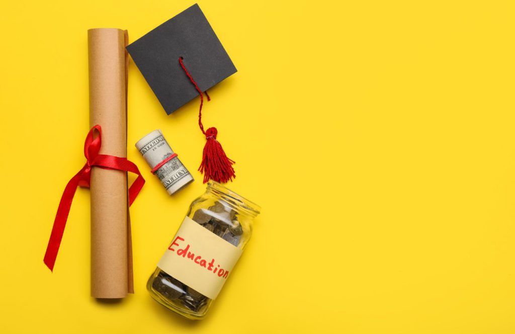 Explore the Pell Grant program with an image featuring a diploma, money, tassel, and coins symbolizing education on a yellow background. Delve into tax insights today.