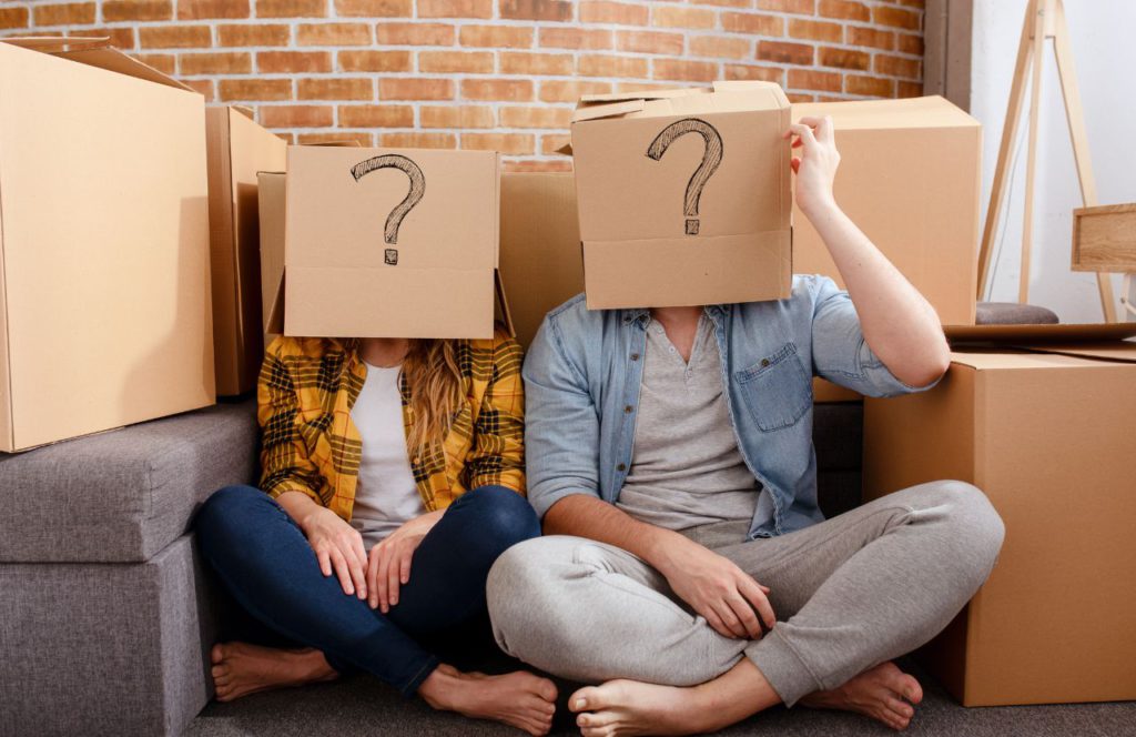 Explore what is non ad valorem tax with our insightful guide. A man and woman with a question marked box on their head because they are puzzled individuals unpacking complex tax laws - visually simplified!