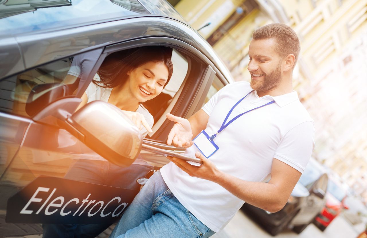 man standing outside electric car explain details to woman driver, are mileage reimbursements taxable